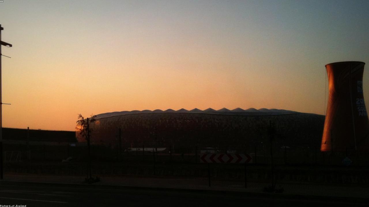 Empty football stadium at twilight.